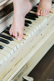 Young Girl By The Piano