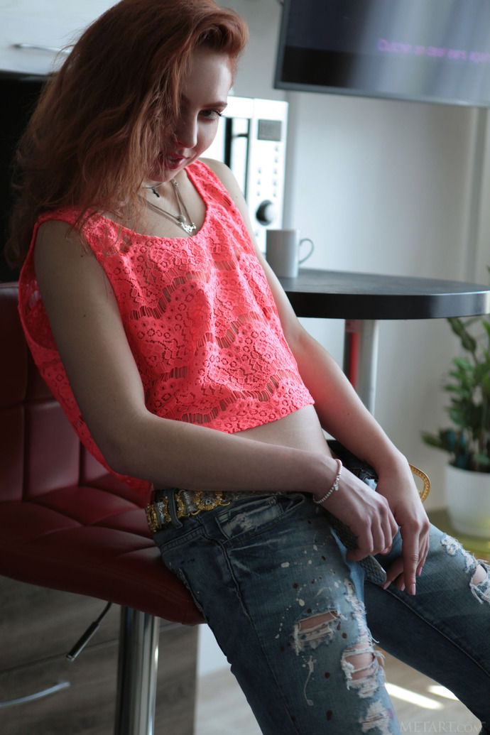 Gorgeous brunette Valery Leche shimmies out of her tight jeans to reveal her pussy, a tiny tuft of hair sitting above the puffy  00