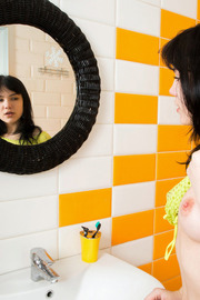 Young brunette Tetti Dew Korti taking shower